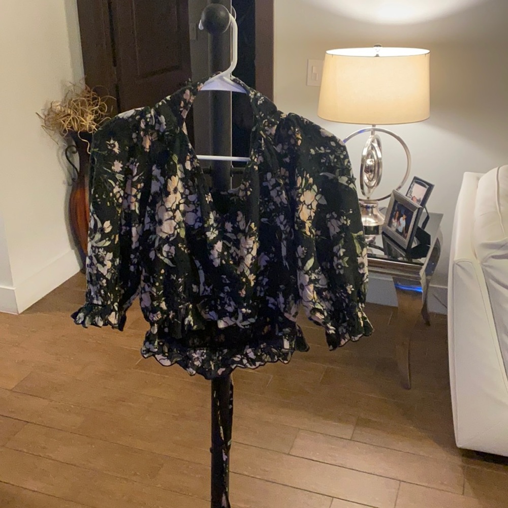 it's a very nice top with flowers around it it's very nice to go out to a club